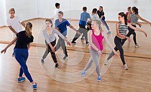 sports teenage boys and girls learning in dance hall