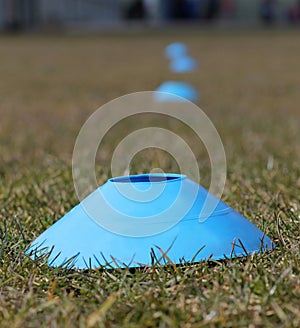 Sports training cones on soccer pitch