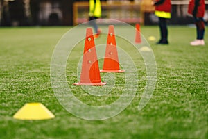Sports Training Equipment on the Grass Pitch. Soccer Football Cones and Markers