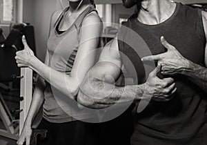 Sports young couple in the gym