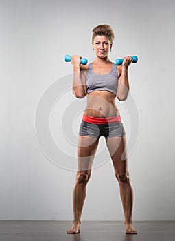 Sports young woman doing warm-up