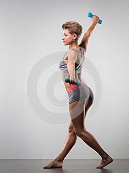 Sports young woman doing warm-up