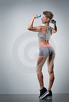 Sports young woman doing warm-up