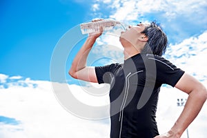 Sportsman drinking pure water when take break or rest time, Relax and Sport concept