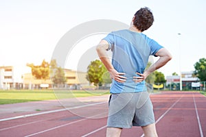 Sportsman feeling backache because of slipped disc