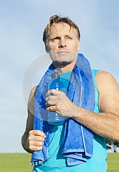 Sportsman holding water bottle.