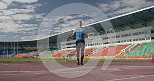 Sportsman jumping with rope on stadium