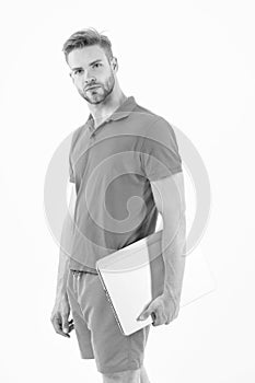 Sportsman with laptop in blue sport wear isolated on white. Man with computer for internet game. Sport bets and gambling