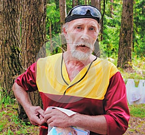 The sportsman with a map after finish on sport