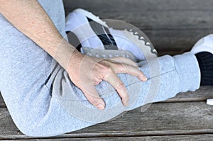 Sportsman with a muscle spasm in his calf