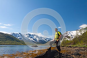 Sportsman near mountain lake
