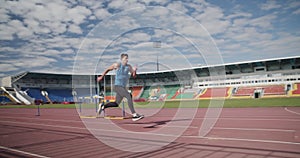 Sportsman practicing long jump on arena.Slow Motion