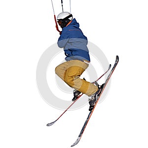 A sportsman practicing snow kiting jumping, isolated on white background. Close-up