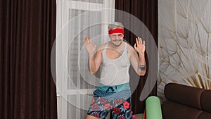 Sportsman retro guy in funny sport clothes waving greeting with hand hello or bye, showing thumbs up