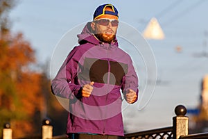 Sportsman running in the city in the morning