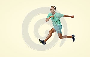 The sportsman running at full speed towards the finish line, advertisement. sportsman runner running isolated on white