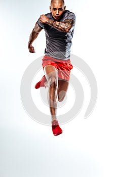 Sportsman running and performing a very high jump