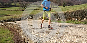 Sportsman with running shoes runs during cross country race