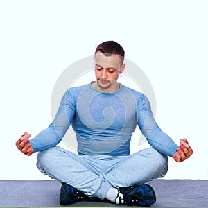 Sportsman sitting in the lotus position