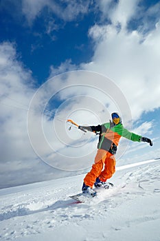 The sportsman on a snowboard runs kite