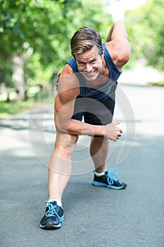 Sportsman stretching his legs