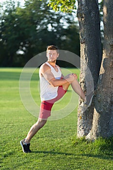 Sportsman stretching outdoors