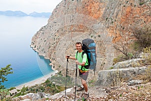 Sportsman on the top of rock. Sport and active