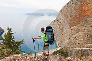 Sportsman on the top of rock. Sport and active