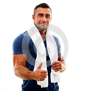 Sportsman with towel showing thumb up