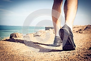 Sportsman walking beach coast. Close up.