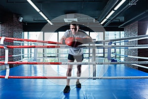 Sportsman wearing dark shorts and grey shirt