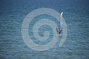 sportsman with wing foil sailing, in the sea. Windsurfing, Extreme Sport. Azov sea, Russia - July 25.2021