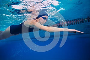 Sportsman woman swimming in crawl (stroke) style photo