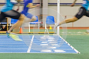 Sportsmen running out finish line in sprint.