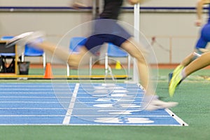 Sportsmen running out finish line in sprint.