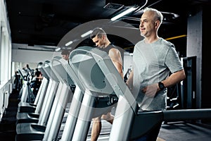 sportsmen running on treadmills