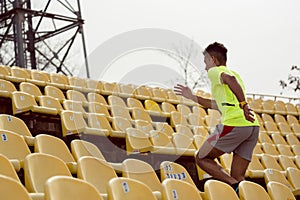 Sportsperson running at stadium photo