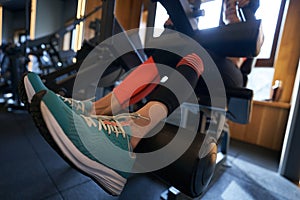 Sportsperson working out on fitness equipment at gym