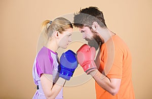 Sportswear. Fight. knockout and energy. couple training in boxing gloves. Happy woman and bearded man workout in gym