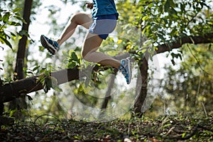 Sportswoman cross country trail running