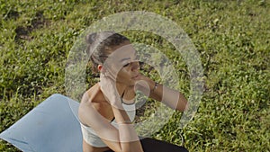 Sportswoman doing abdominals workout on yoga mat