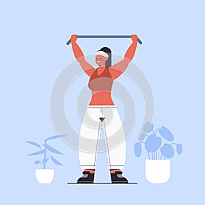 Sportswoman doing exercises with resistance band girl having workout cardio fitness training healthy lifestyle