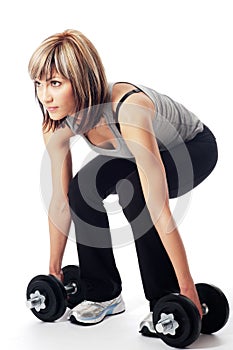 Sportswoman with dumbbells