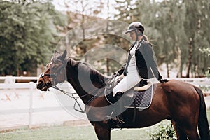 The sportswoman on a horse. The horsewoman on a red horse. Equestrianism. Horse riding. Horse racing