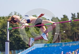 Sportswoman jumps in height