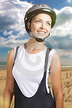 sportswoman in professional cycling clothes posing against natural background. composite image