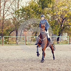 Sportswoman riding horse on equestrian competition