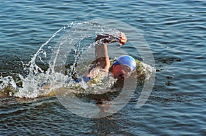 The sportswoman swim in water
