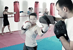 Sportswomen competing in colored boxing gloves