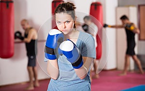 Sportwoman practicing boxing punches